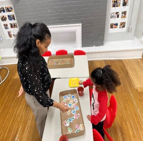 A woman playing with a girl in family place